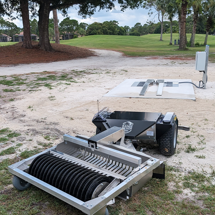 Relox Robotics Range Picker pulling up to charging station at Legacy Golf